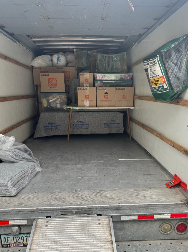 Crew member loading truck